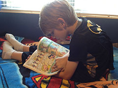 Boy reading a comic