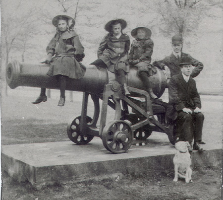 Family and dog on and around the Russian canon on the Embankment, Bedford