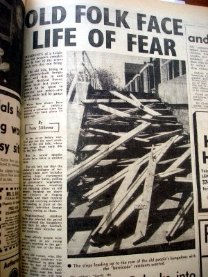 Newspaper article and photograph of collapsed staircase