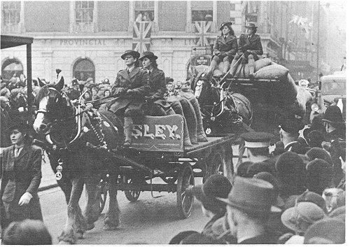 Anne Bridge drives the first horse-drawn cart in the parade for Princess Elizabeth, 14 February 1946