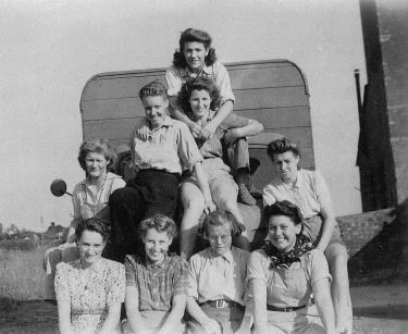 Bolnhurst group on lorry bonnet outside their hostel c1944