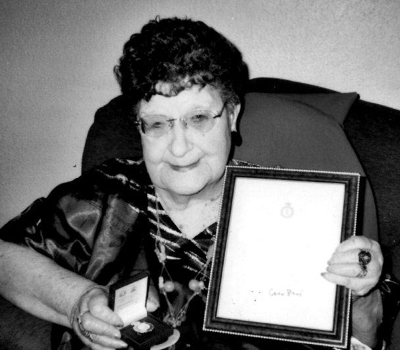 Gladys Parratt nee Wilding holding her WLA Veteran's Badge and certificate, awarded in October 2008 