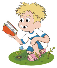 Boy reading a book in the garden