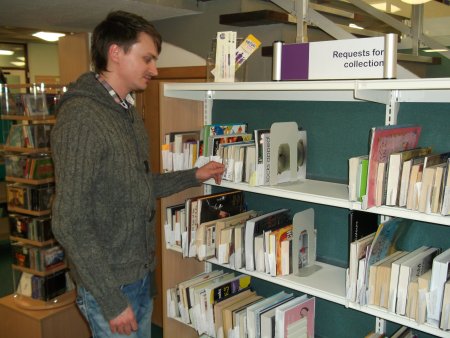 Member of staff at the request shelves