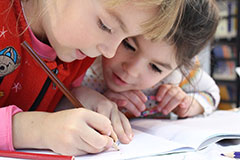 Two girls doing their homework