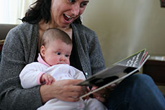 Child reading with mum