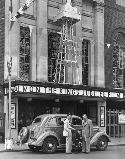 Reginald Dixon, Alan Crawley and Sydney Crawley in front of the Granada Cinema, Bedford May 1935. Copyright Alan Crawley.