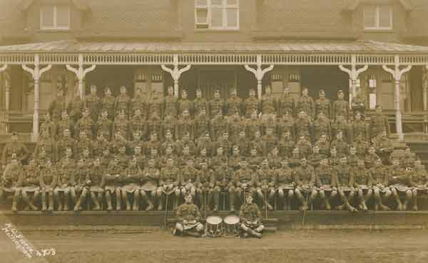 A company of the 6th Seaforth Highlanders outside Bedford Grammar School's cricket pavilion