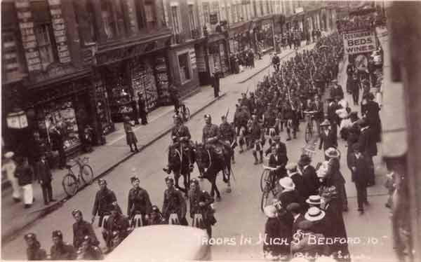 Gordon Highlanders marching  along the High Street
