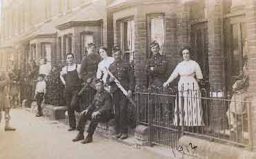 Soldiers standing outside billets on York Street. The date on the back says October 1914. 1914 The back of the postcard reads "To Ada From Reg. Took Sept 3 1914"