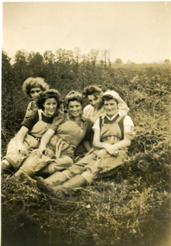 Bolnhurst land girls sitting in a field
