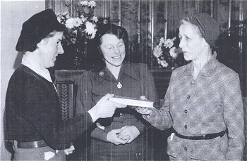 Phyllis Chiplin presents Inez Jenkins with a book on Bedfordshire
