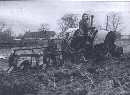 Land girl ploughing in Colmworth area