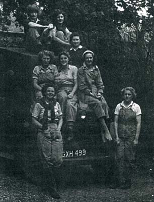 Ravensden land girls on the bonnet of a lorry