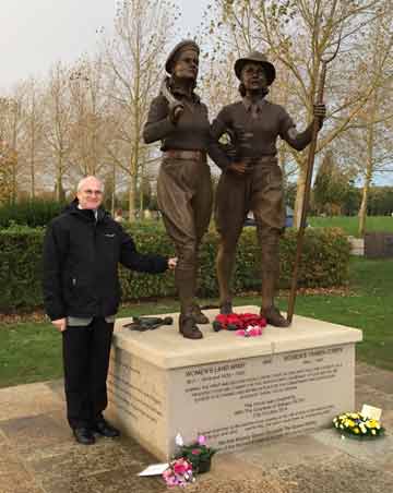 Stuart Antrobus next to the Women's Land Army Tribute sculpture