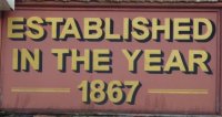 Sign outside Goldings, 107 High Street, Bedford