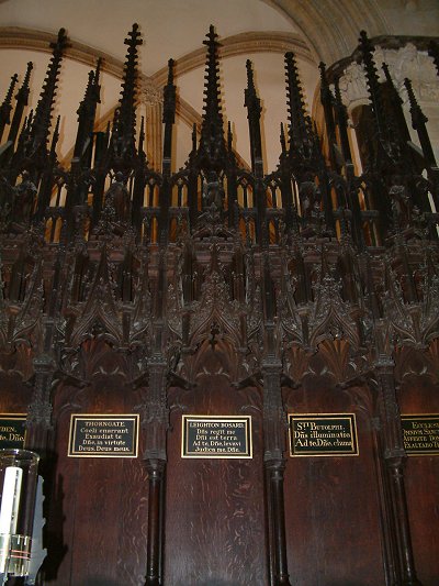 Stall in Lincoln cathedral showing plaque to Leighton Busard