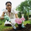 A woman planting a flower