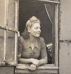 Land girl at window