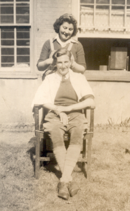 Liz Day having her hair cut at Cople House hostel