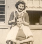 Liz Day having her hair cut at Cople House hostel