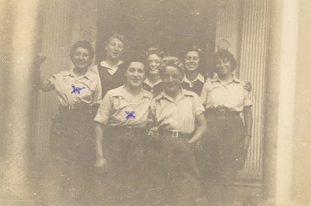 Potton land girls in front of the entrance to The Hollies.